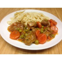 Émincé de poulet sauce brune à l'orange, poêlée de courgettes et pommes sautés